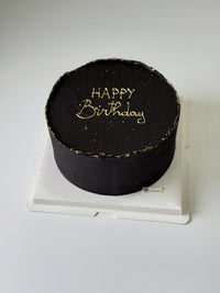 round black birthday cake