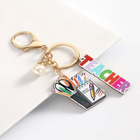 Personalized Best Teacher Wooden Keychain engraved on premium wood by Giftsnboxes Nigeria.